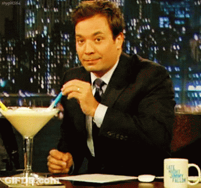 Man In Suit And Tie With Martini GIF