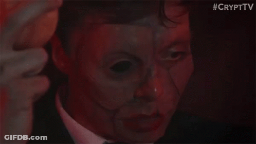 Man In Suit And Tie With Mask GIF