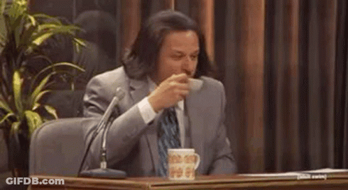 Man In Suit And Tie With Microphone Coffee GIF