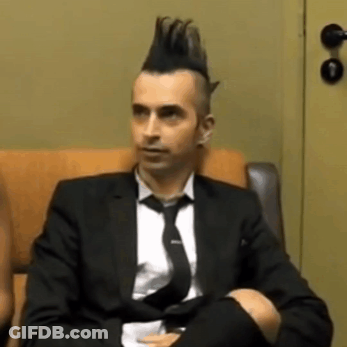Man In Suit And Tie With Mohawk GIF