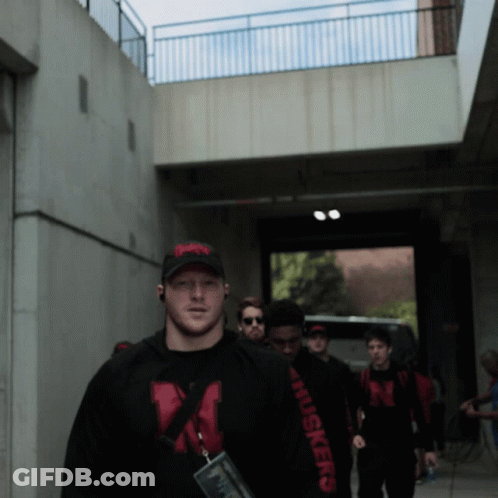 Man In Suit And Tie With N On Shirt GIF