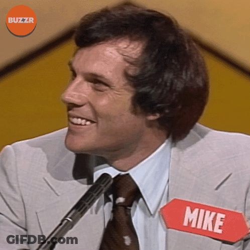Man In Suit And Tie With Name Tag Mike GIF
