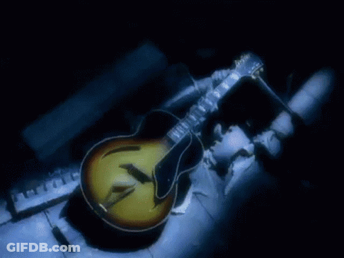 Man In Suit And Tie With Noir On Head GIF