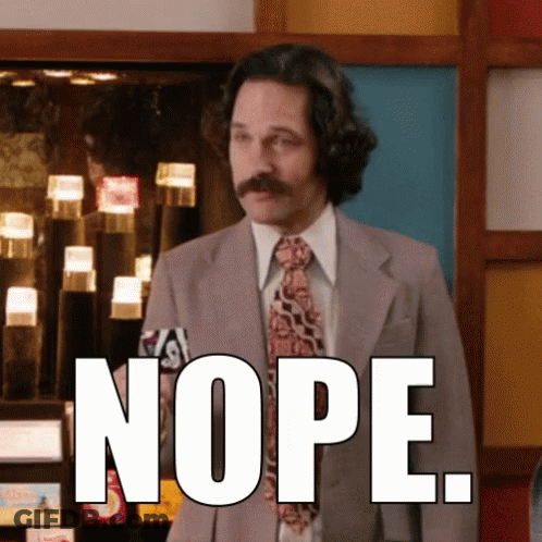 Man In Suit And Tie With Nope On Chest GIF