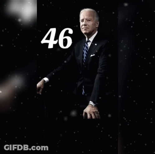 Man In Suit And Tie With Number 46 Behind Him GIF