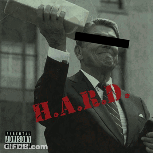 Man In Suit And Tie With Parental Advisory Label GIF