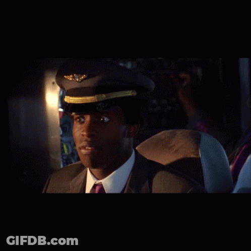 Man In Suit And Tie With Pilot Hat GIF