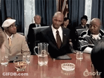 Man In Suit And Tie With Pitcher Of Water GIF