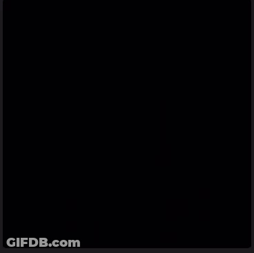 Man In Suit And Tie With Robots GIF