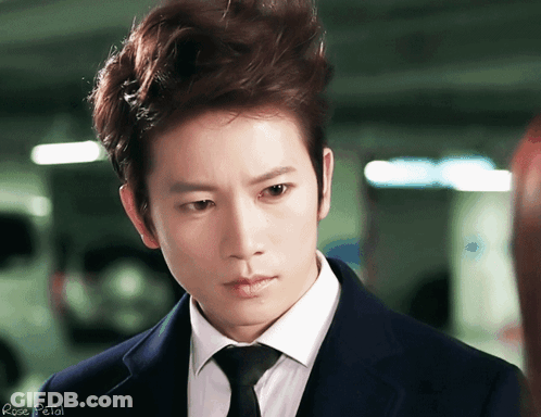 Man In Suit And Tie With Rose Petal GIF