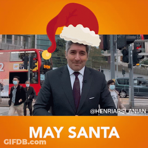 Man In Suit And Tie With Santa Hat GIF