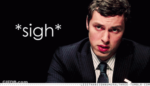 Man In Suit And Tie With Sigh GIF