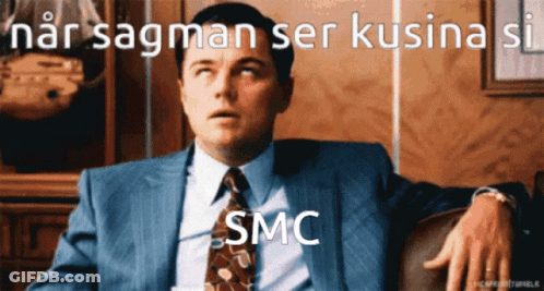 Man In Suit And Tie With SMC On Face GIF