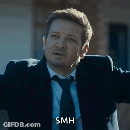 Man In Suit And Tie With SMH On Face GIF