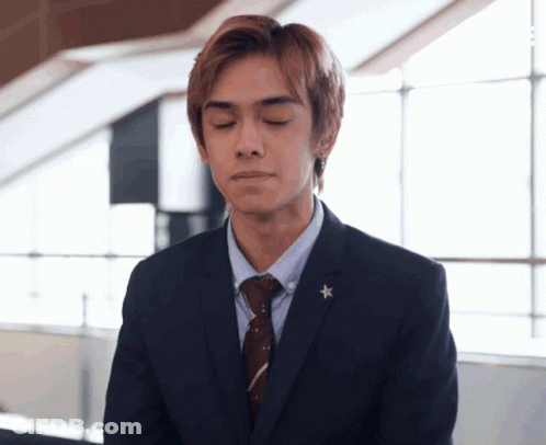 Man In Suit And Tie With Star GIF