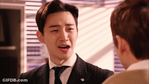 Man In Suit And Tie With T.M. Pin GIF