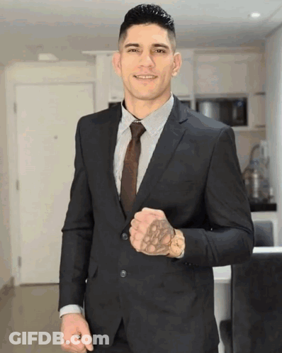 Man In Suit And Tie With Tattoo GIF