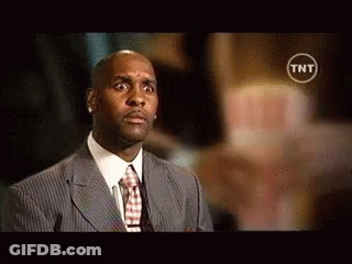 Man In Suit And Tie With TNT Logo GIF