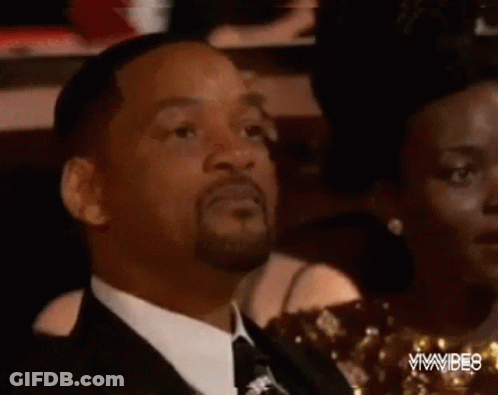 Man In Suit And Tie With Tongue Out GIF