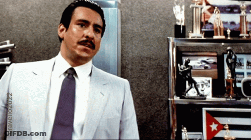 Man In Suit And Tie With Trophies GIF