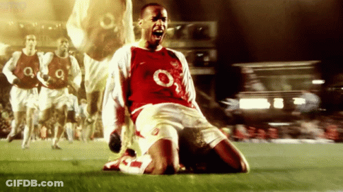 Man In Suit And Tie With UEFA Champions League Sign GIF