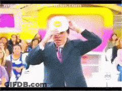 Man In Suit And Tie With White Hat And Sun GIF
