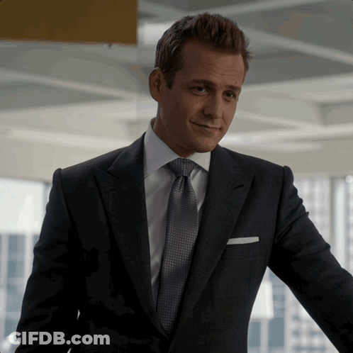 Man In Suit And Tie With White Pocket Square GIF