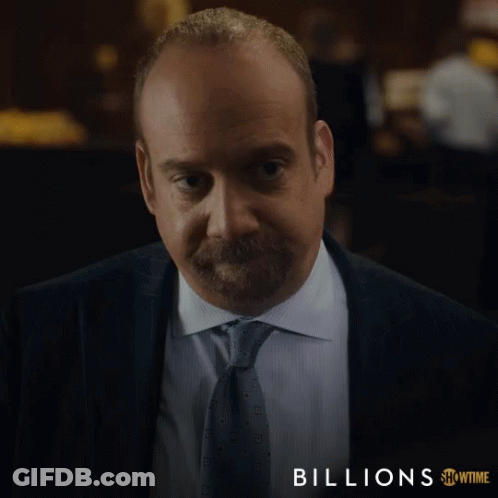 Man In Suit And Tie With Word Billions GIF