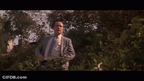 Man In Suit And Tie With Word Defense GIF