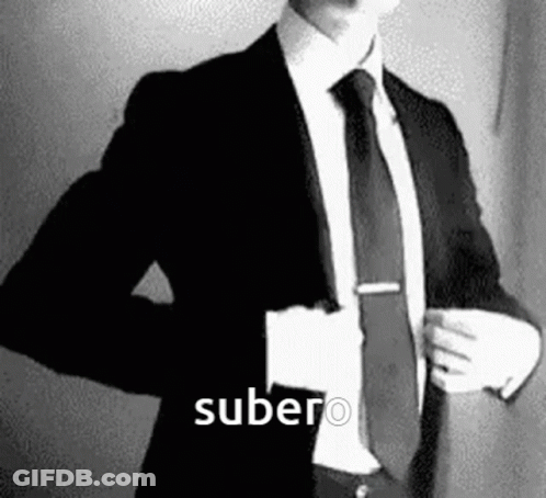 Man In Suit And Tie With Word Subero GIF