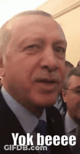 Man In Suit And Tie With Yok Beee GIF