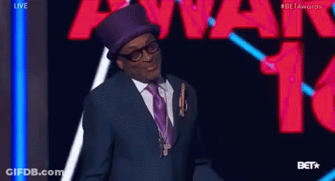 Man In Suit And Top Hat With Beta Awards Sign GIF