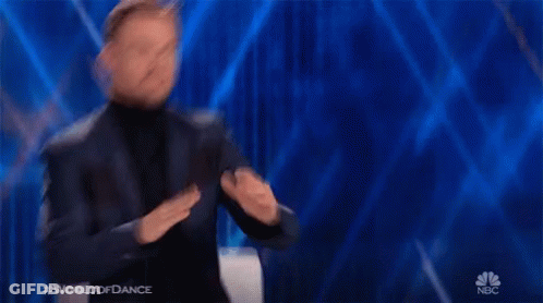 Man In Suit And Turtleneck Dancing On NBC GIF