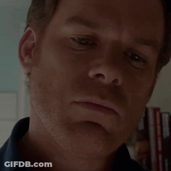 Man In Suit And Turtleneck In Green Chair Youngrock GIF
