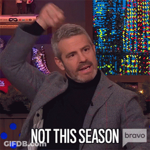 Man In Suit And Turtleneck Raising Fist Saying Not This Season GIF