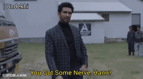 Man In Suit And Turtleneck Talking GIF
