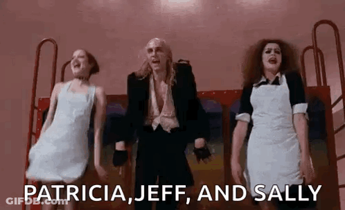 Man In Suit And Two Women Dancing GIF