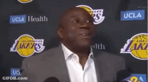 Man In Suit And White Shirt At Microphone GIF