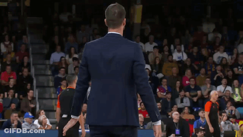 Man In Suit And White Shirt Clapping At Crowd GIF