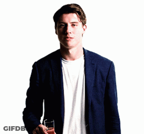 Man In Suit And White Shirt Holding Champagne GIF