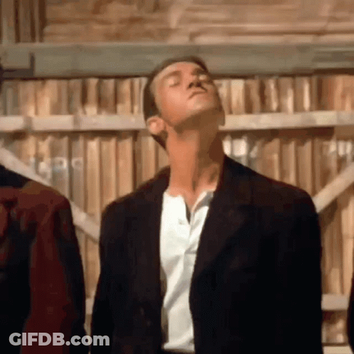 Man In Suit And White Shirt Looking Up GIF
