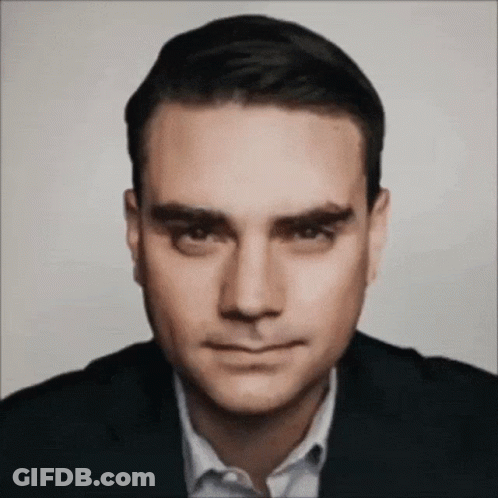 Man In Suit And White Shirt Looks Serious GIF