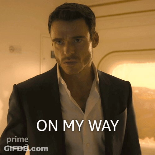 Man In Suit And White Shirt Saying On My Way GIF