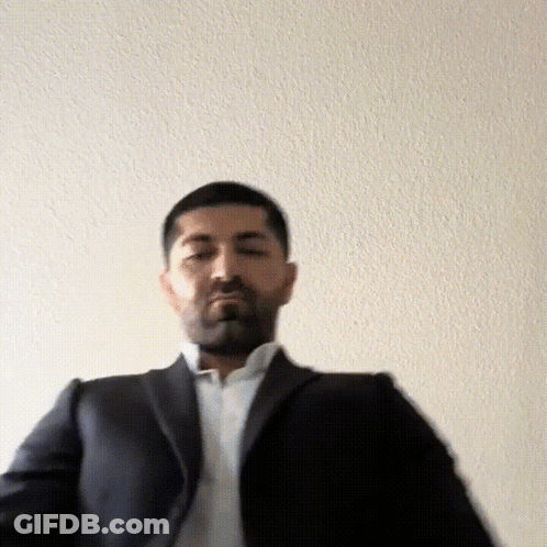 Man In Suit And White Shirt Standing GIF