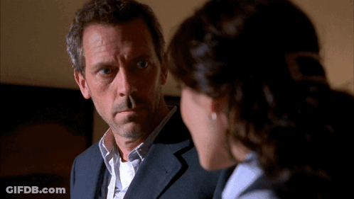 Man In Suit And Woman In Blue Shirt GIF