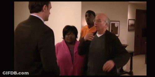 Man In Suit And Woman In Pink Jacket GIF