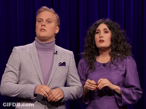 Man In Suit And Woman In Purple Dress GIF