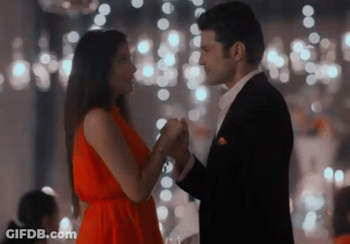 Man In Suit And Woman In Red Dress Dancing GIF