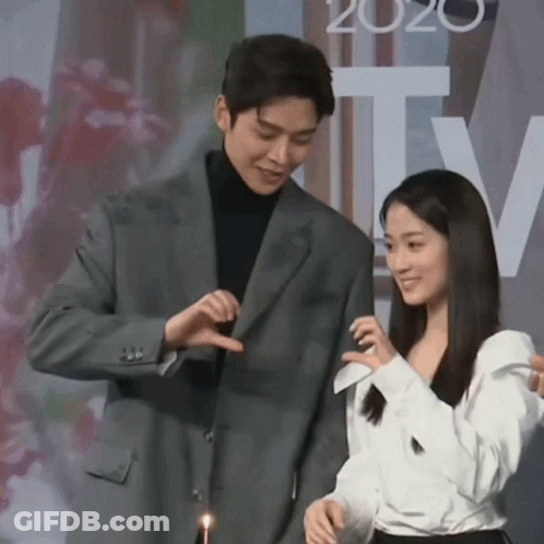 Man In Suit And Woman In White Shirt With 2020 GIF