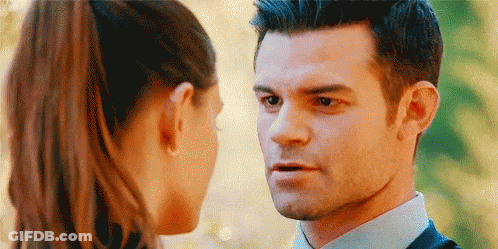 Man In Suit And Woman Looking At Each Other GIF
